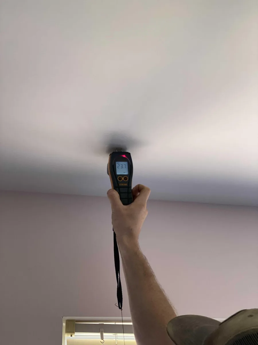 Checking ceiling moisture at a Dresher property.