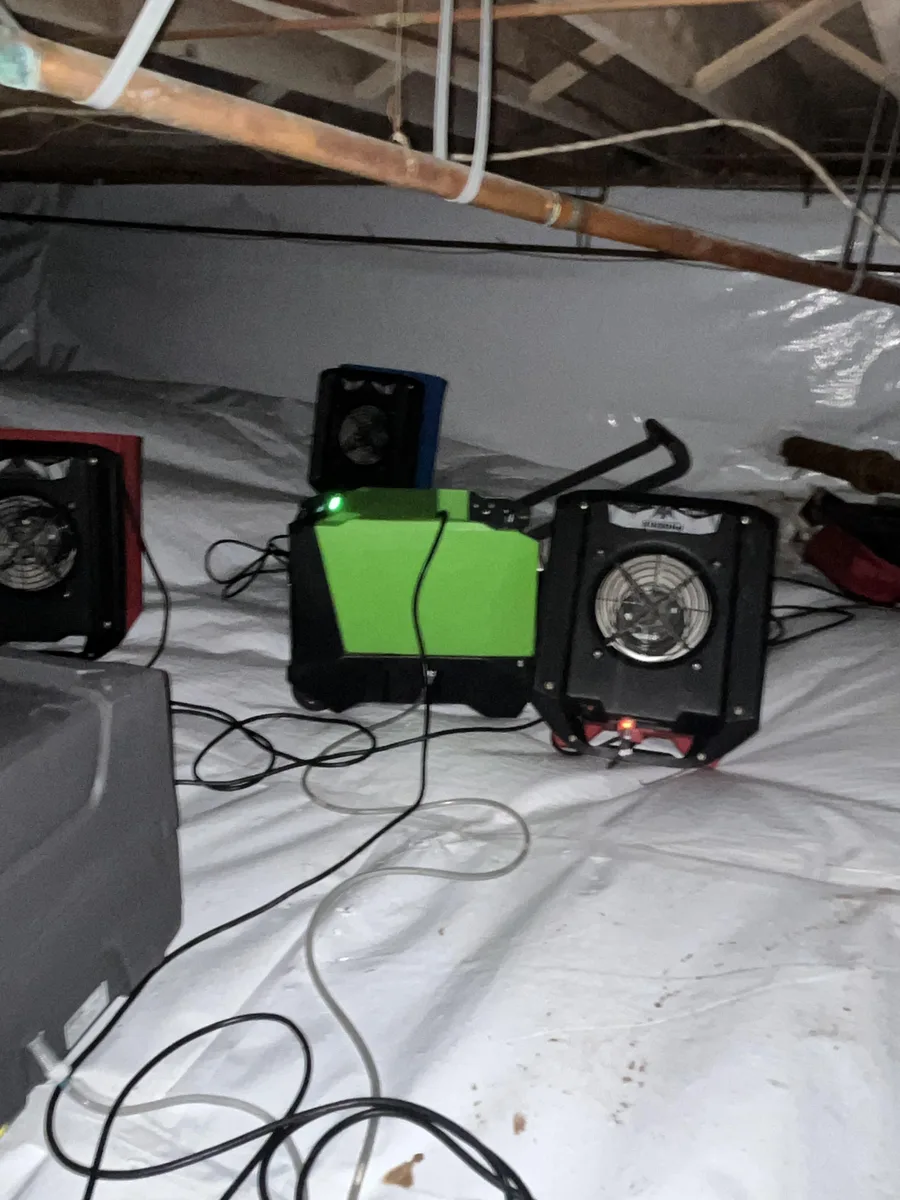 Air movers and a dehumidifier in a crawlspace at an Upper Dublin property.