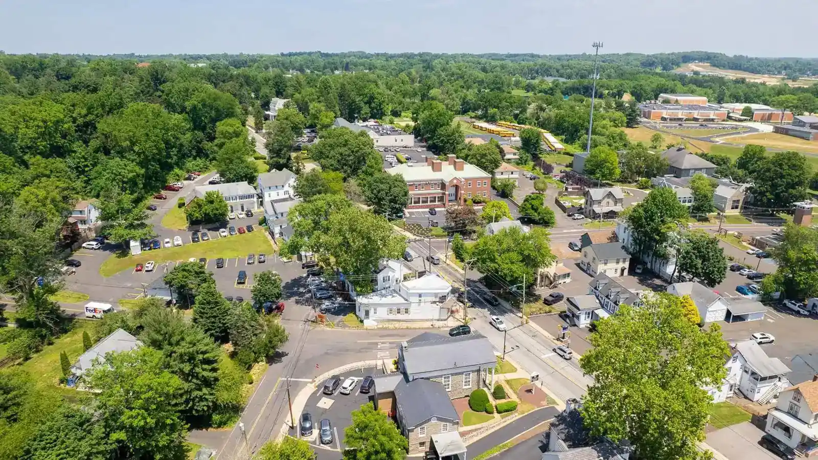 Aerial view of houses and tree-lined streets.